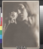 Weston, Edward (1886-1958) The White Iris. 1921. [Tina Modotti, nude bust portrait leaning toward iris]. Platinum or palladium print. Overall, Primary Support: 9 1/2 x 7 1/2 in. (24.1 x 19 cm) Overall, Secondary Support: 17 15/16 x 14 in. (45.6 x 35.6 cm) Image: 9 1/2 x 7 1/2 in. (24.1 x 19 cm). Johan Hagemeyer Collection/Purchase. Inv. N.: 76.5.27