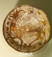 Islamic art Lustreware plate with a design of a gazelle in lustre on an opaque white glaze.